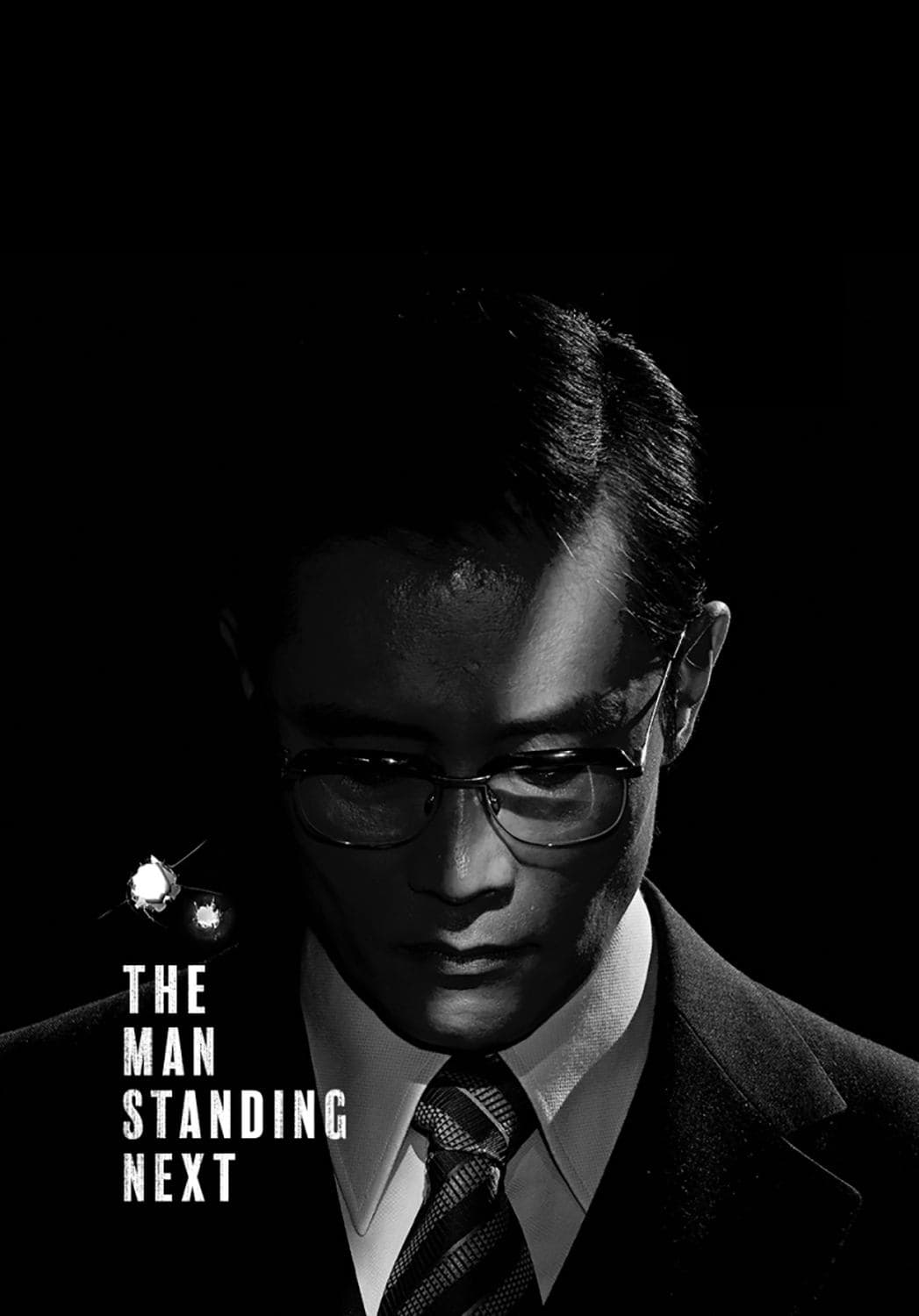 The Man Standing Next photo